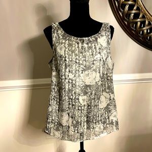 Beautiful white silver sleeveless satiny fabric. Perfect for the holidays.